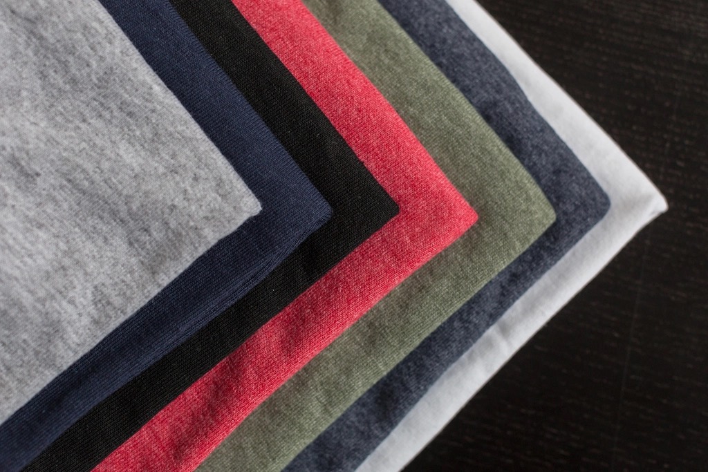 A stack of folded t-shirts